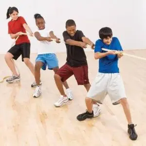 Corporate Family Day picnic midway tug-of-war staged next to BBQ and food-truck row in the Dallas Fort Worth area