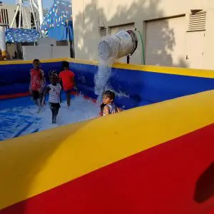 Foam dance pit rental filled with shoulder-high foam at a Dallas Fort Worth summer party