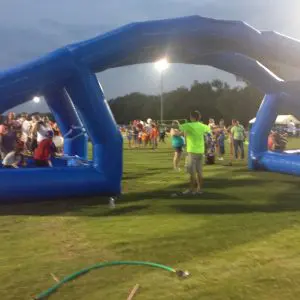 Water Wars battle station rental with two players firing water balloons at a Dallas Fort Worth summer event