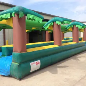 Inflatable water slide rental staged in a Dallas Fort Worth backyard on grass